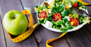 Healthy fitness green salad and apple